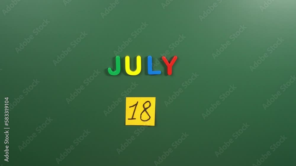 Hand sticking a sticker 18 July calendar day on school board. 18 date of July. Eighteenth day of July. 18th date number. 18 day calendar. Eighteen date. International Nelson Mandela Hand sticking a sticker 18 July calendar day on school board. 18 date of July. Eighteenth day of July. 18th date number. 18 day calendar. Eighteen date. International Nelson Mandela
