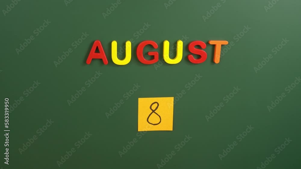 Hand sticking a sticker 8 August calendar day on school board. 8 date of august. Eighth day of august. 8th date number. 8 day calendar. Eight date. International Cat Day Hand sticking a sticker 8 August calendar day on school board. 8 date of august. Eighth day of august. 8th date number. 8 day calendar. Eight date. International Cat Day
