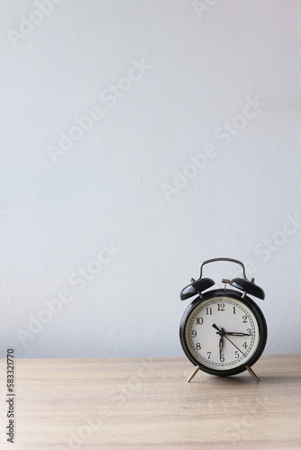 Minimalist room with a clock on empty wall background