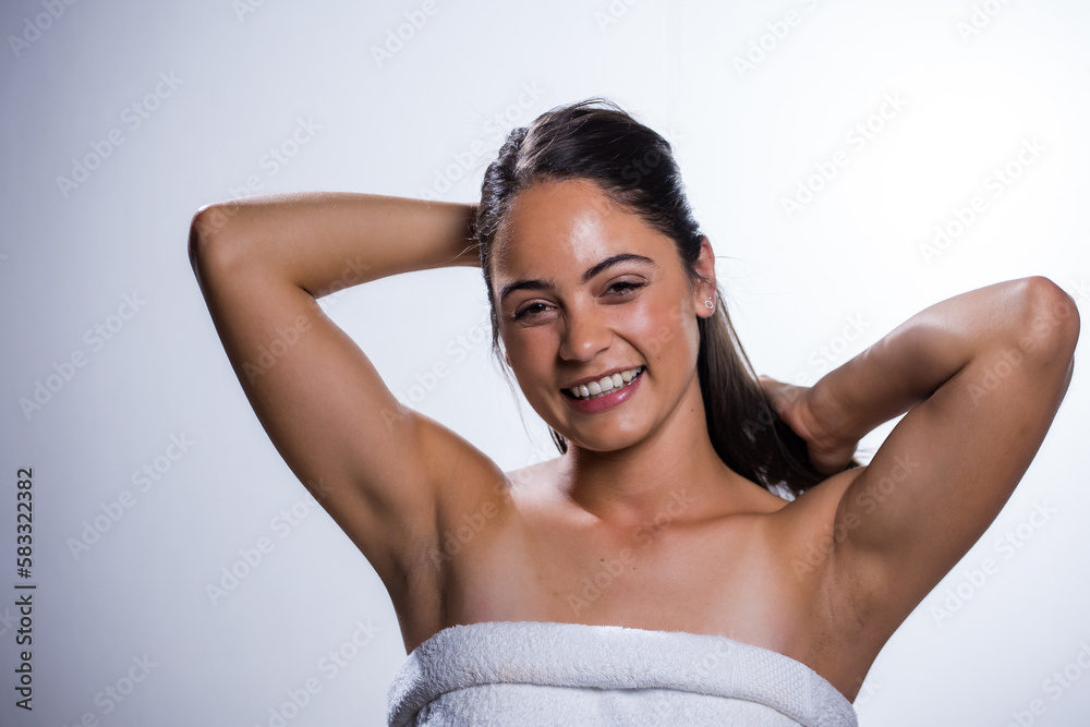 Obraz premium Glowing Beauty: Young Woman's Beauty Routine on White Background