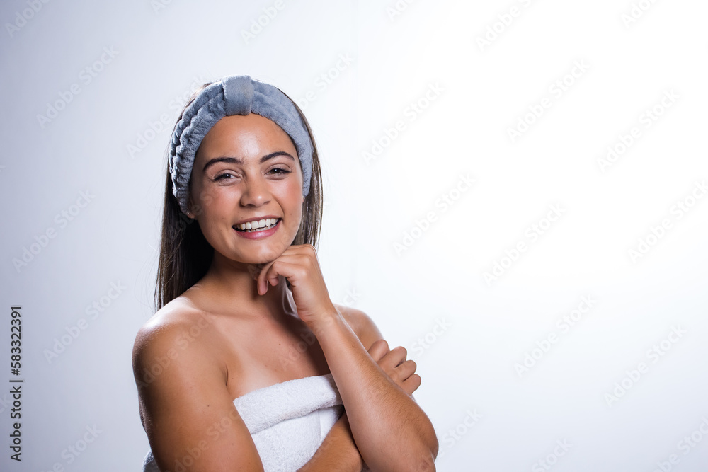Glowing Beauty: Young Woman's Beauty Routine on White Background Glowing Beauty: Young Woman's Beauty Routine on White Background