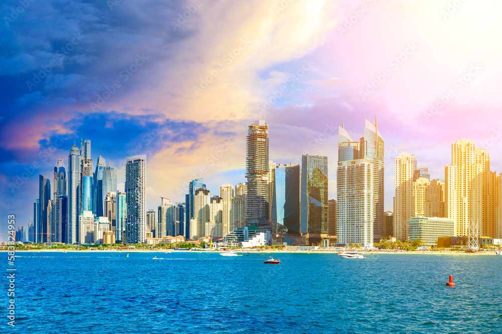 Fototapeta premium View of the Persian Gulf's golden sand beaches, the Dubai Marina, the JBR neighborhood, and the sunset. UAE vacations and holidays