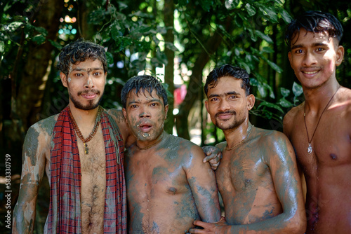 Group of south asian boys smiling portrait standing at outdoor, young boys in holi festival, the dirty dash game on durga puja occasion 