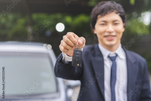 Business car rental, sell or buy service, dealership hand of agent dealer, sale man giving auto key of vehicle to customer renter, buyer receiving, client or tenant, transfer automobile.