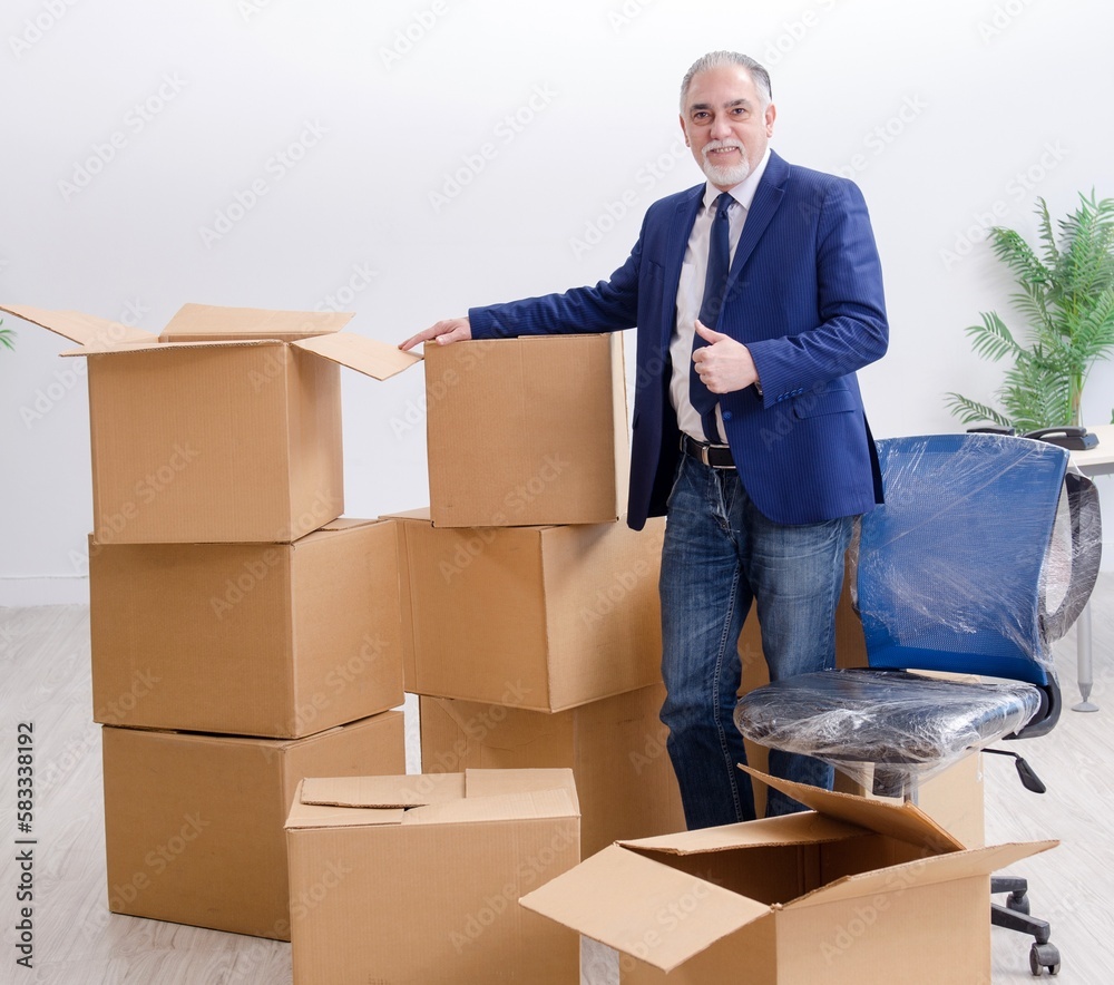 Aged businessman moving to new workplace Aged businessman moving to new workplace
