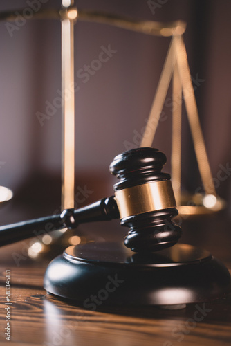 Legal and law concept. Close-Up of scales of justice and wooden judge gavel on wooden table.