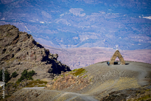 Landscape of the Alpujarras of Granada with the monument to the Virgen de las Nieves in the foreground and the mountains in the background