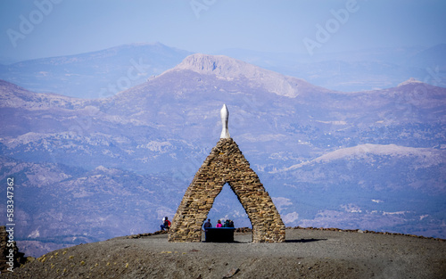 Landscape of the Alpujarras of Granada with the monument to the Virgen de las Nieves in the foreground and the mountains in the background