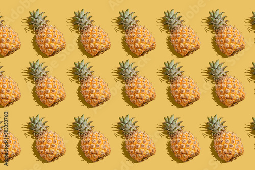 pineapple on a yellow background pattern © JuliaLavleis
