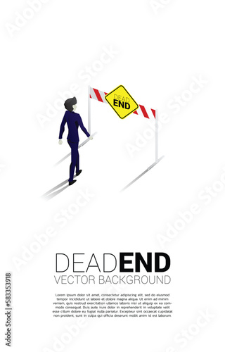 Silhouette businessman walking to dead end signage . Concept of wrong decision in business or end of career path.