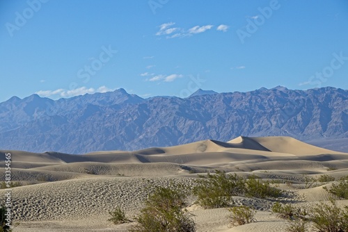 The Mesquite Flat sand dunes rise above Stovepipe Wells in Death Valley, with the Panamint Range and Grapevine Mountains rising aove the valley on both sides.