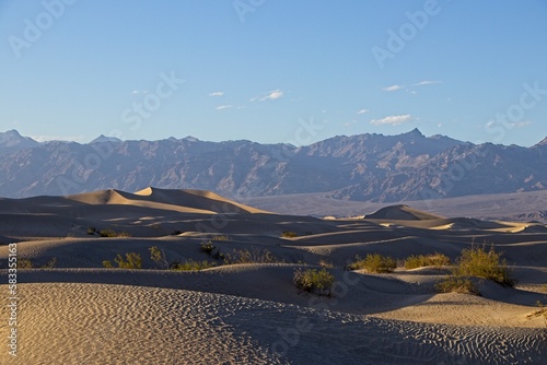 The Mesquite Flat sand dunes rise above Stovepipe Wells in Death Valley, with the Panamint Range and Grapevine Mountains rising aove the valley on both sides.