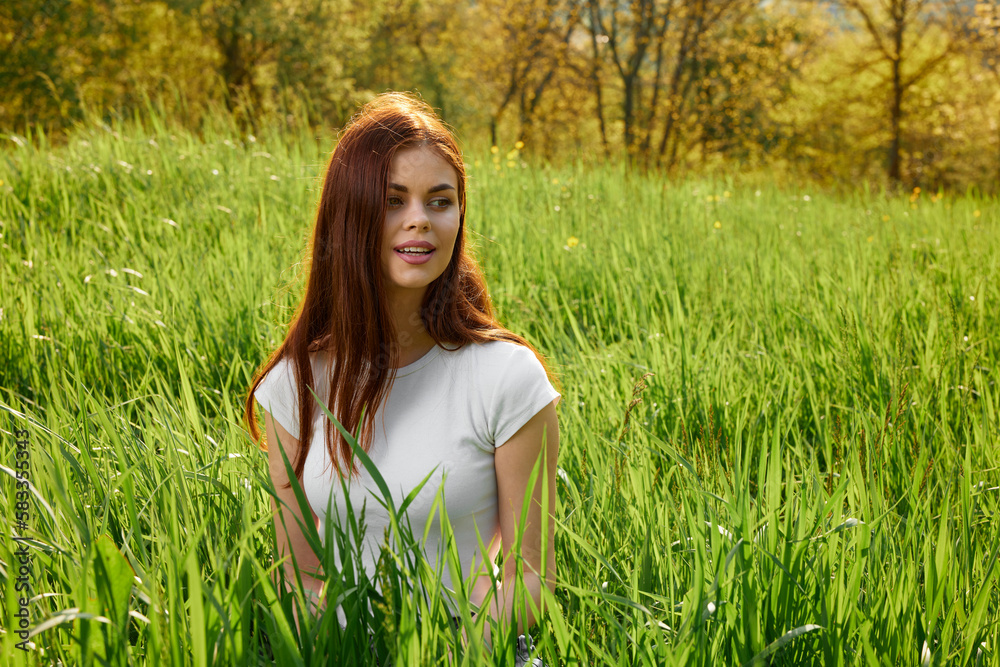 happy cheerful woman laying in green grass happy cheerful woman laying in green grass