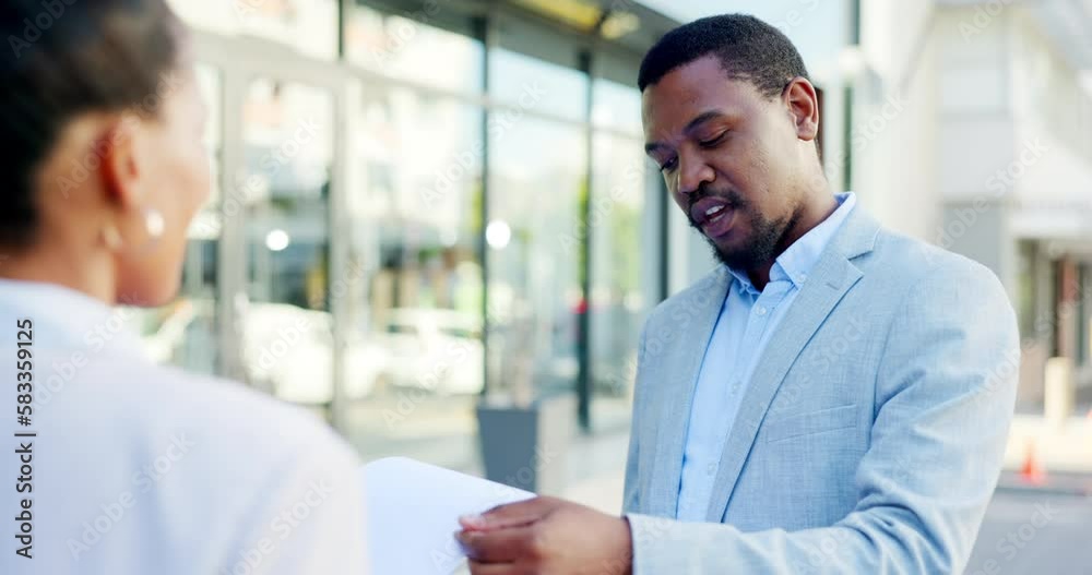 Sales, insurance and businessman or salesman talking to a client explaining using a clipboard outdoors in a city or town. Advice, explain and male agent having a conversation in the street
