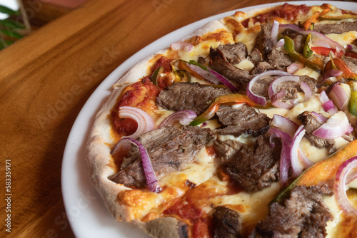 delicious steak pizza with beef and onions