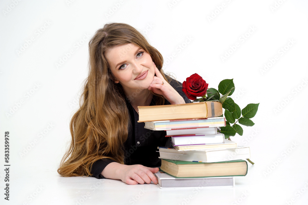university woman teacher lies on textbooks with rose in her hands sexy teacher teacher in high heels in black clothes with flowing hair white background place for text red rose training Come to us university woman teacher lies on textbooks with rose in her hands sexy teacher teacher in high heels in black clothes with flowing hair white background place for text red rose training Come to us