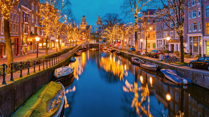 Amsterdam Netherlands canals with Christmas lights during December, canal historical center of Amsterdam at night. Europe