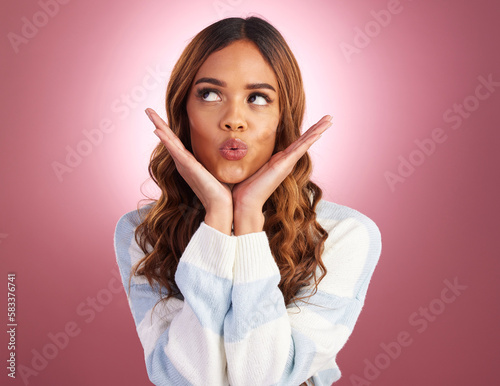 Kiss, face and woman in a studio with funny, silly and emoji expression with a purple background. Female model, youth and happiness of a young and happy person kissing with a pout and casual fashion