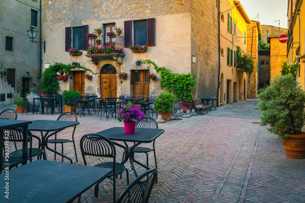 Cozy street cafe at early morning in Tuscany, Pienza, Italy