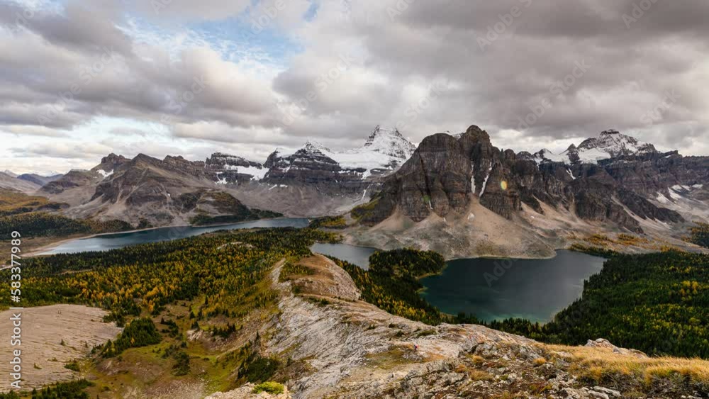 Scenery of Mount Assiniboine with Sunburst Lake and Cerulean Lake in autumn forest on Nublet viewpoint in Assiniboine provincial park Scenery of Mount Assiniboine with Sunburst Lake and Cerulean Lake in autumn forest on Nublet viewpoint in Assiniboine provincial park