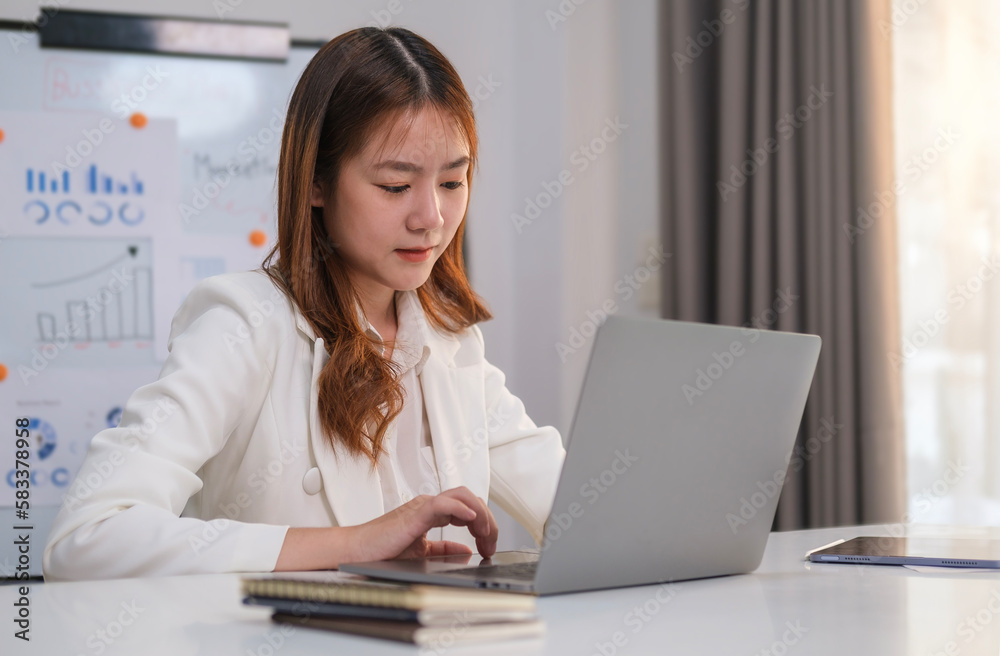 Focused female manager typing on laptop keyboard, checking email, taking part in online meeting at office desk. Focused female manager typing on laptop keyboard, checking email, taking part in online meeting at office desk.