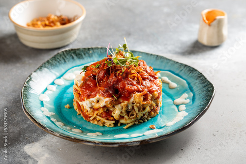 Kushari served in dish isolated on table top view of arabic breakfast photo