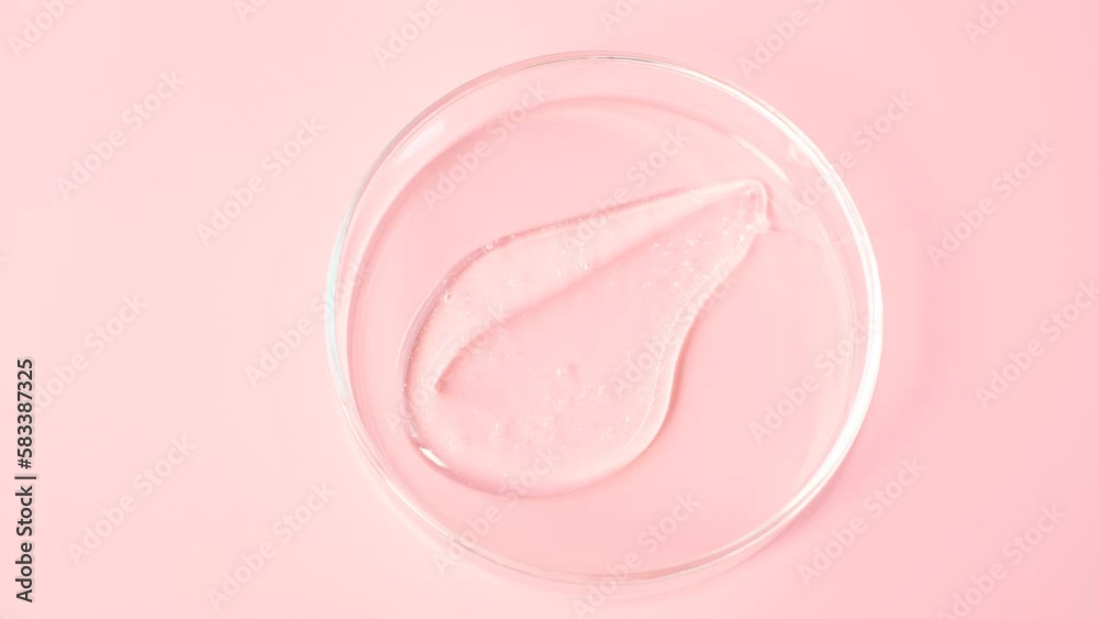 Smear of shower gel or shampoo on pink background close-up top view. Smear of shower gel or shampoo on pink background close-up top view.