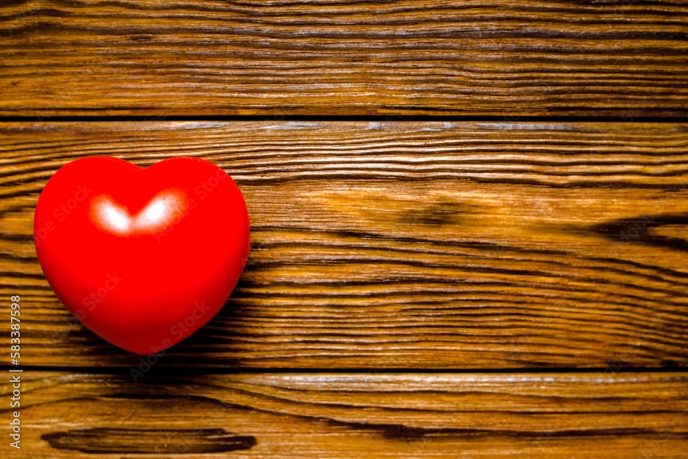 A symbol of love on brown wooden background
A symbol of love on brown wooden background