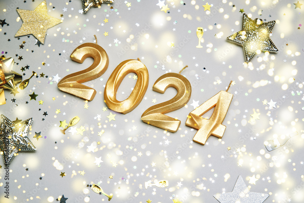 Holiday background Happy New Year 2024. Numbers of year 2024 made by gold candles on bokeh festive sparkling background. celebrating New Year holiday, close-up. Space for text Holiday background Happy New Year 2024. Numbers of year 2024 made by gold candles on bokeh festive sparkling background. celebrating New Year holiday, close-up. Space for text