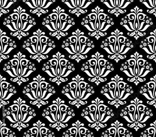 Wallpaper in the style of Baroque. Seamless vector background. White and black floral ornament. Graphic pattern for fabric, wallpaper, packaging. Ornate Damask flower ornament