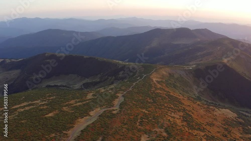 4k drone flight back and up footage (Ultra High Definition) of Chornogora mountain range. Unbelievable sunrisein Carpathian mountains, Ukraine, Europe. Beautiful summer scenery.. photo