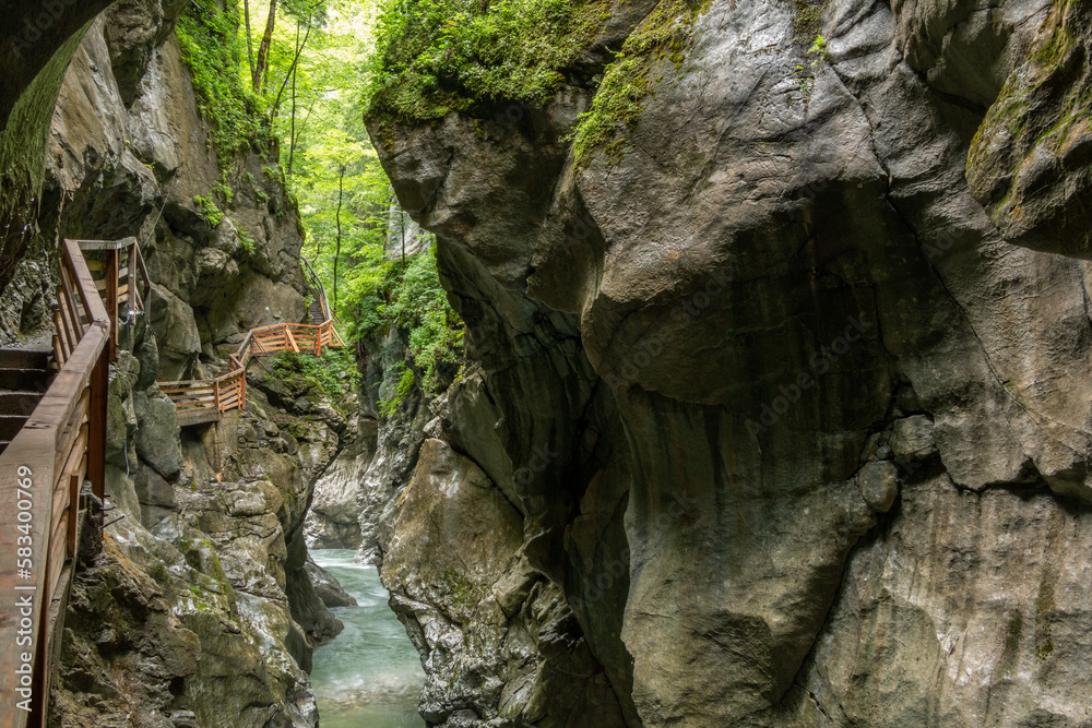Winding path with wooden railings in Austria's Lammer River Gorge