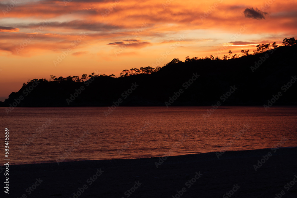 Fototapeta premium sunset on the beach view with yellow sky