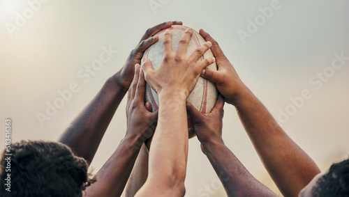 Diversity, team and hands together in sports on rugby ball for support, motivation or goals outdoors. Hand of sport group unity in fitness, teamwork or success for match preparation or game photo