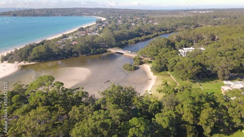 Aerial drone view of Huskisson in the City of Shoalhaven on the shores of Jervis Bay, NSW, Australia, heading toward Moona Moona Creek on a bright sunny morning     photo