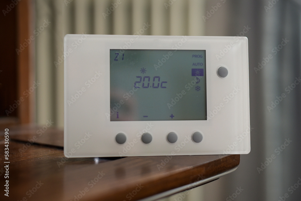 view of a thermostat set with a temperature of twenty degrees view of a thermostat set with a temperature of twenty degrees