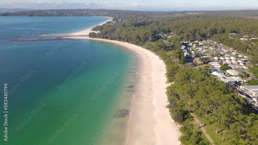 Aerial drone view of Huskisson in the City of Shoalhaven on the shores of Jervis Bay, NSW, Australia, traveling along Huskisson Beach on a bright sunny morning Aerial drone view of Huskisson in the City of Shoalhaven on the shores of Jervis Bay, NSW, Australia, traveling along Huskisson Beach on a bright sunny morning