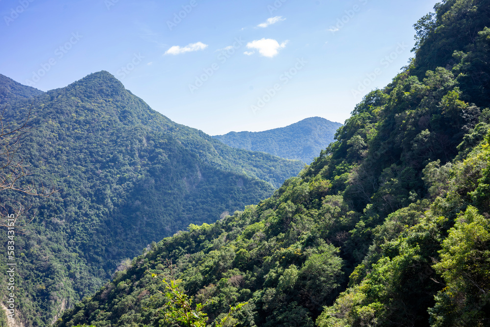 Beautiful view of the open landscape with mountains, forest and canyon.. It's a sunny day on the Walami Trail in Yushani National Park in Taiwan near Yuli.