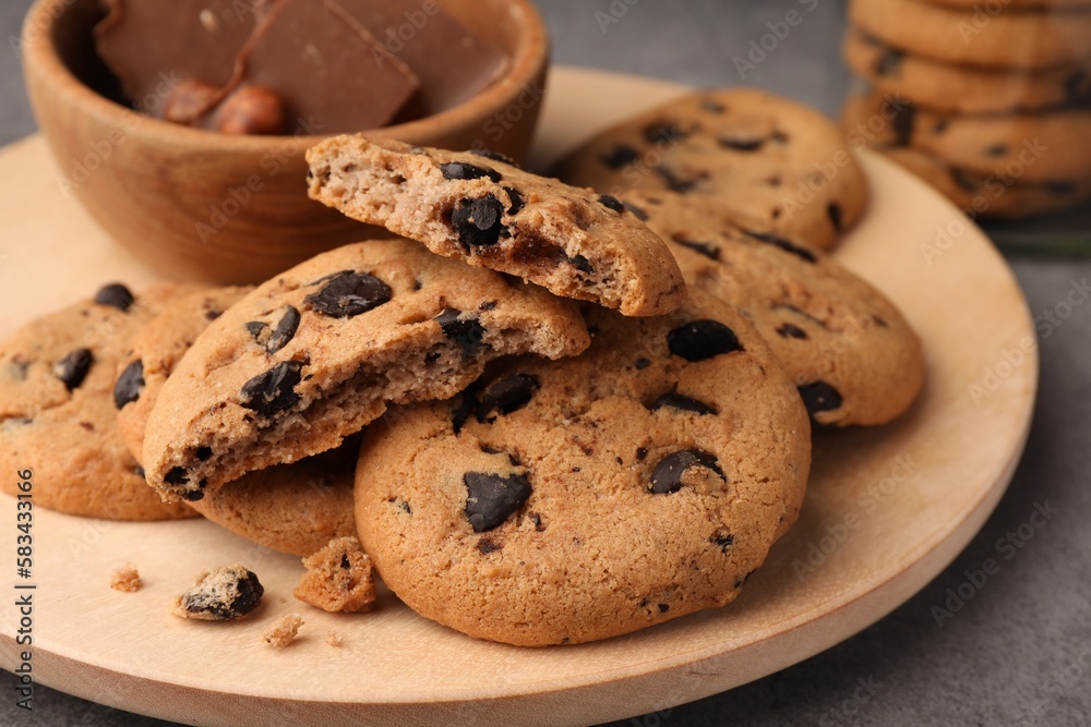 Delicious chocolate chip cookies on grey table, closeup Delicious chocolate chip cookies on grey table, closeup