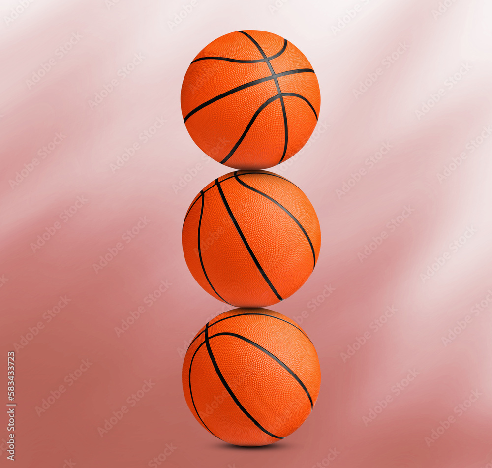 Stack of basketball balls on coral background Stack of basketball balls on coral background