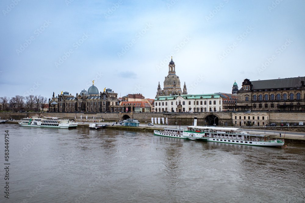 Germany, Dresden, view to city with elbe river and historical steamships in the foreground. High quality photo