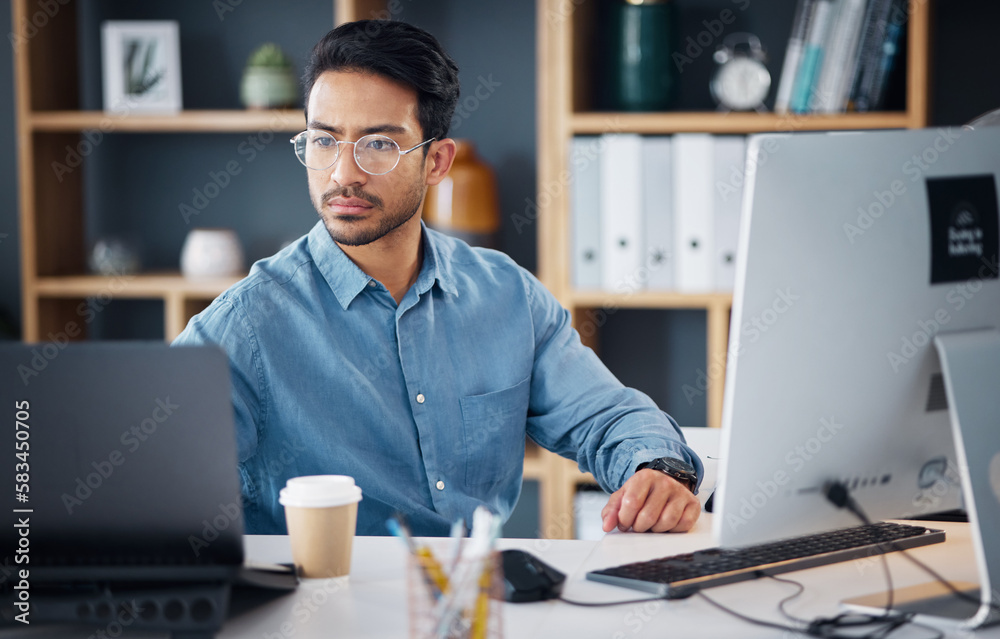 Serious, laptop and business man in office for startup management, digital planning and trading. Focused male worker at computer technology for online project, website and internet research at table