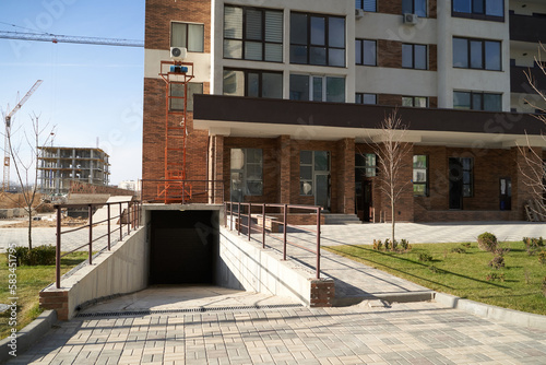 The entrance to the underground parking of the apartment building.