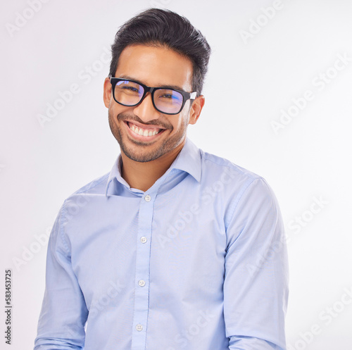 Portrait, vision and eyewear with a man in studio on a white background to promote eye care optometry. Face, glasses or eyesight with a handsome young male wearing new prescription frame spectacles © Lune/peopleimages.com