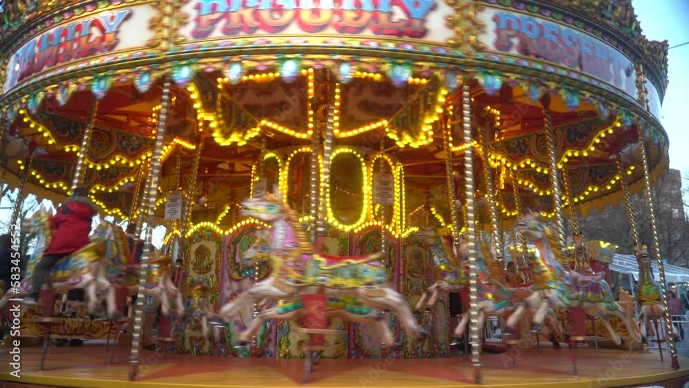 Kilkenny. Ireland. A beautiful carousel spinning in an amusement park Kilkenny. Ireland. A beautiful carousel spinning in an amusement park