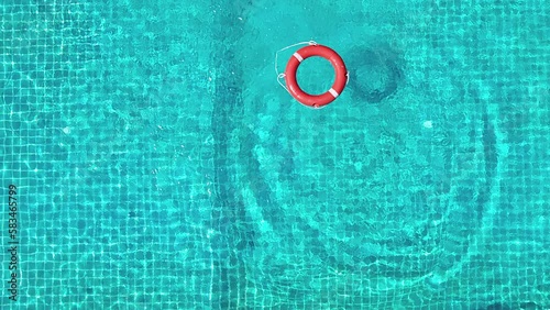 A view from above of the pool in which the life preserver is thrown. photo
