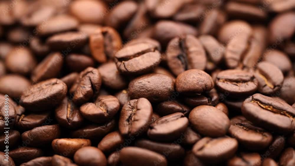 Roasting coffee beans. Slow rotation of coffee beans. Texture of coffee. Invigorating drink.
Roasting coffee beans. Slow rotation of coffee beans. Texture of coffee. Invigorating drink.