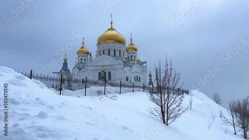 Belogorsky St. Nicholas Orthodox Missionary Monastery. Russia, Perm Krai, Belaya Gora. The temple on the hill in winter. Monastery on the background of snow. 4K photo