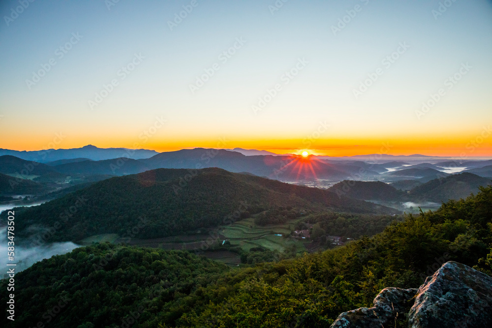 Obraz premium Spring sunrise in La Fageda D En Jorda Forest, La Garrotxa, Spai
