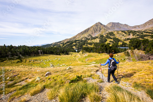 Young hiker girl enjoying in Camporrells, Pyrenees, France